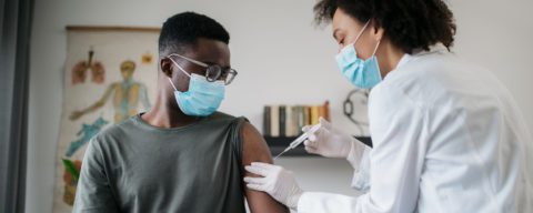 Teen getting vaccine shot 5x2