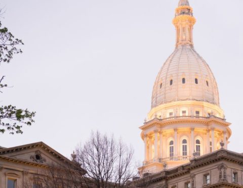 The lights come up on the capital building in Lansing