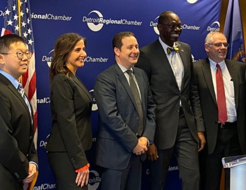 Speakers posing at the Global Detroit news conference