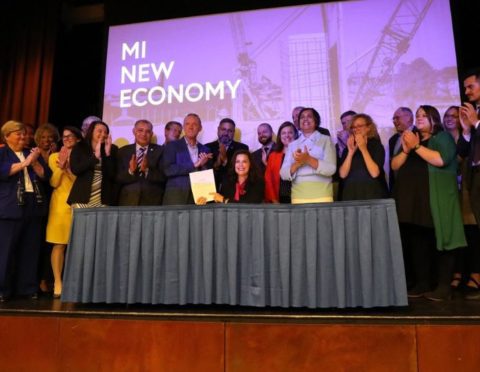 Gov. Whitmer signing the Michigan Achievement Scholarship