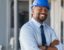 A Black male developer in a construction hat
