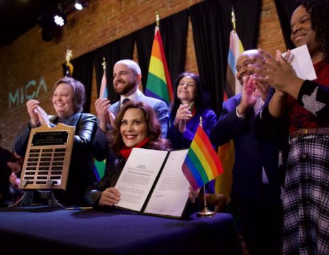 Gov. Gretchen Whitmer signs legislation expanding the Elliott-Larsen Civil Rights Act (ELCRA).