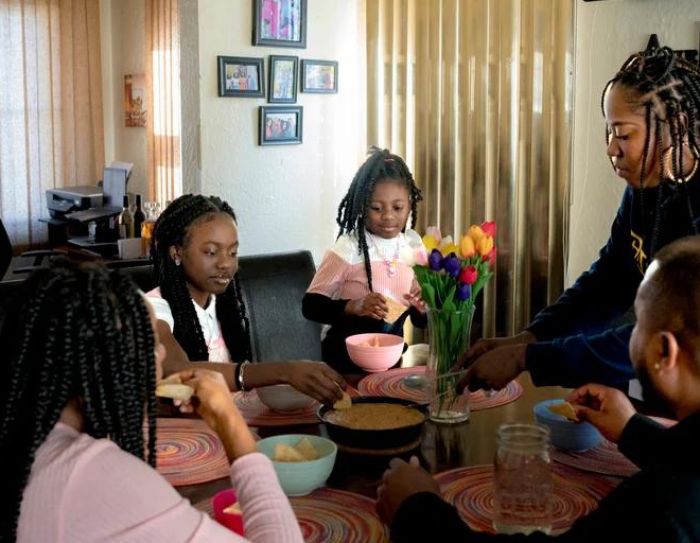 The Larsosa family, from left, Karis, 16, Kady, 14, Klir, 7, Krystal and Jasahn have dinner at their home in Detroit.