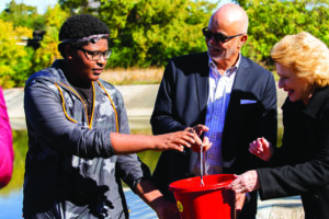 Wayne County Executive Warren C. Evans and Senator Debbie Stabenow attend a community fishing event.