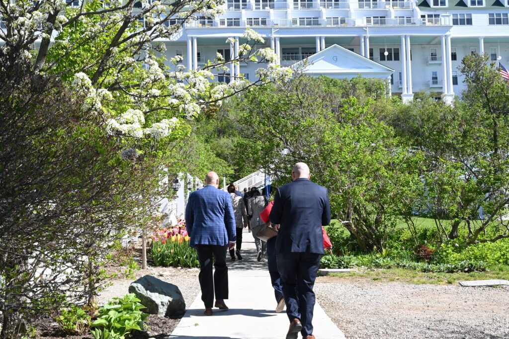 Mackinac Policy Conference attendees walking outside Grand Hotel