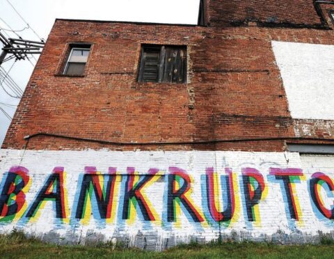 A painted mural depicting the word bankruptcy