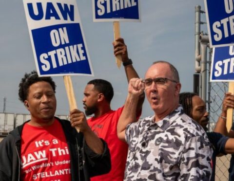 UAW President Shawn Fain walks the picket line