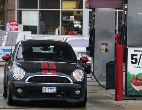 A vehicle is fueled at a gas station