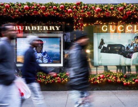 Shoppers walk past the Macy's flagship store in New York City