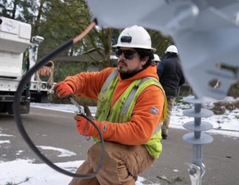 A worker from Portland General Electric