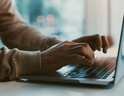 A man typing on a computer