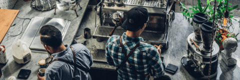 small business idex repor findings - two male employees working at coffee shop