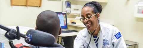 A doctor smiling with a patient