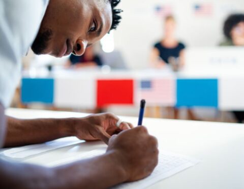 Michigan Business United For Elections - Business employee casting ballot