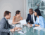 analysis paralysis - business leaders and anxiety - small group of individuals looking over paperwork - featured web