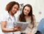 female primary care provider speaking to women patient