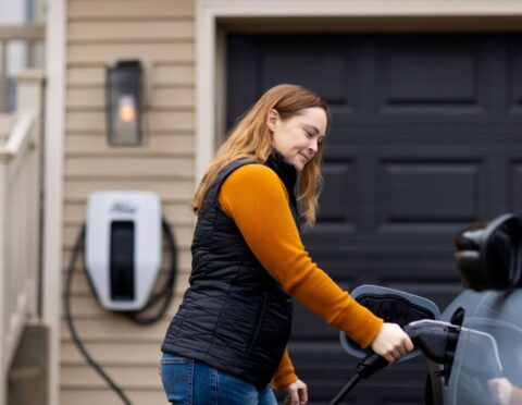 Kallie Ford using an EV charger