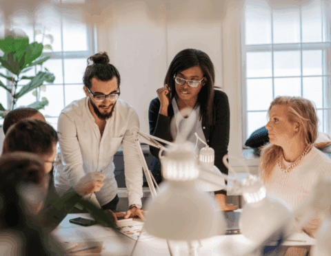 june small business grants - featured web multi-racial team working on a grant