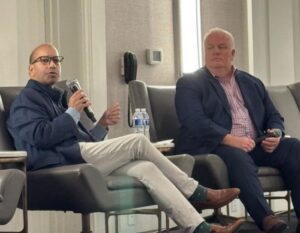 Sandy K. Baruah and Glenn Stevens Jr. speaking