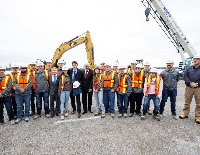 On October 5, 2018, Canadian Prime Minister Justin Trudeau (middle left) and Michigan Gov. Rick Snyder (middle right) mark the official start of construction for the Gordie Howe International Bridge project.