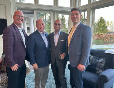 The Chamber's Brian Shoaf, Sandy K. Baruah, and Adam Majestic with former Mayor Mike Duggan