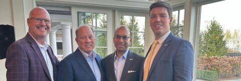 The Chamber's Brian Shoaf, Sandy K. Baruah, and Adam Majestic with former Mayor Mike Duggan