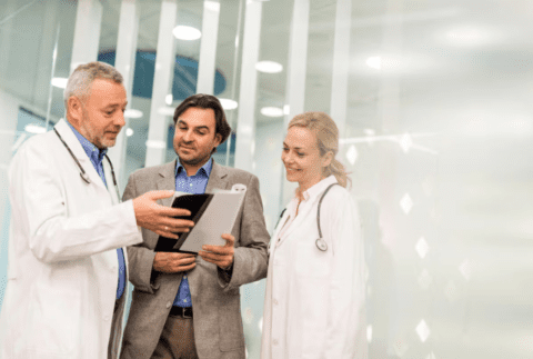 Three people conversing