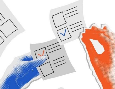 Hands holding ballots