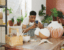 Shot of a young man taking pictures of his finished products with a smartphone in a pottery studio